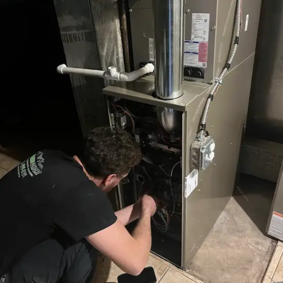 image of Technician Servicing Furnace